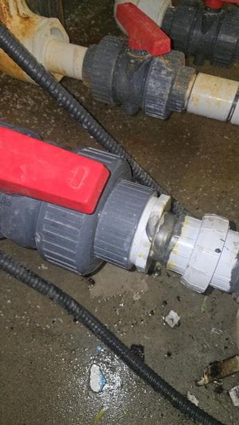 Calgary plumber servicing pipe and valve drain system